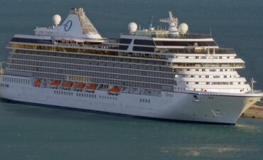 Large cruise ship docked at harbor