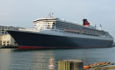 Large cruise ship docked in harbor