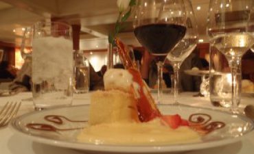 a plate of dessert and wine glasses