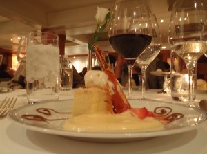 a plate of dessert and wine glasses