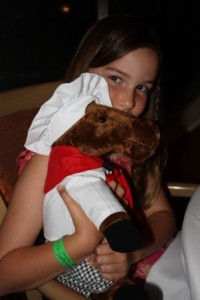 a girl holding a stuffed animal