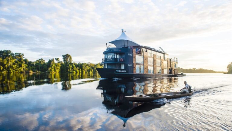 Aria amazon on a river next to a canoe