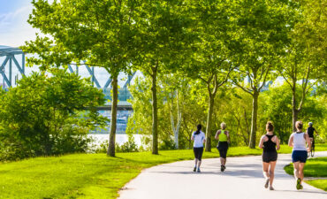 Active travellers going for a jog on the river bank