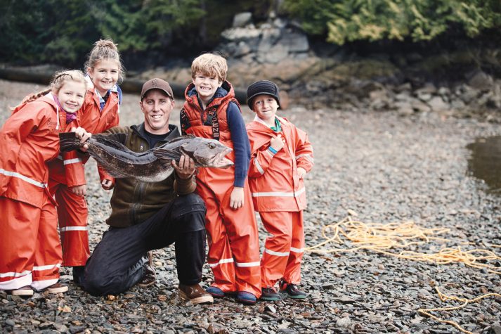 Children with a local Alaskan fisherman