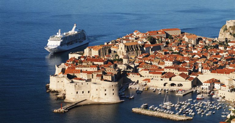 A cruise ship enters the historic city of Dubrovnik