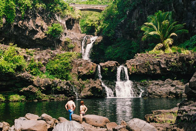 Man and woman at Hana Maui Hawaii waterfall