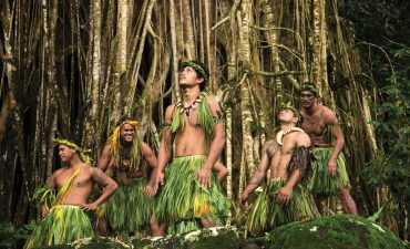 Marquesan men perform a traditional dance