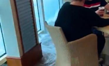 British tourists keep calm and carry on drinking… while their cruise ship floods!