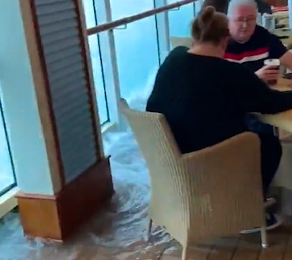 British tourists keep calm and carry on drinking… while their cruise ship floods!