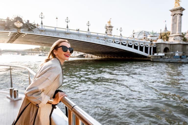 Woman riding ship near a bridge over the river