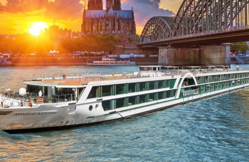 Cruise ship in river below a bridge