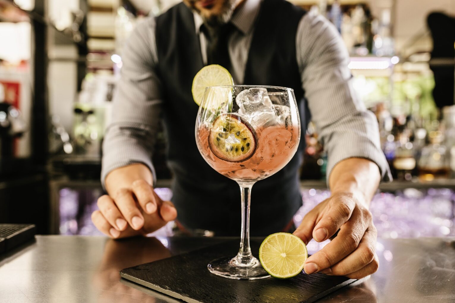 Waiter serving cocktail