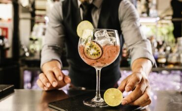 Waiter serving cocktail