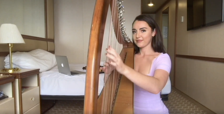 Ruby Princess' guest entertainer Kate, plays her harp and violin