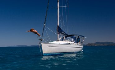 Woman diving off the boat