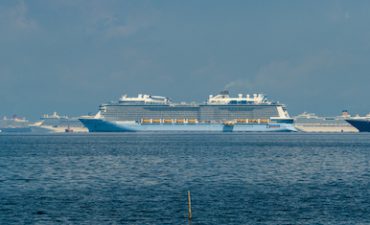 Cruise ships and container ships seen moored in Manila Bay