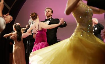 Cunard ballroom dancing couples twirl the night away.