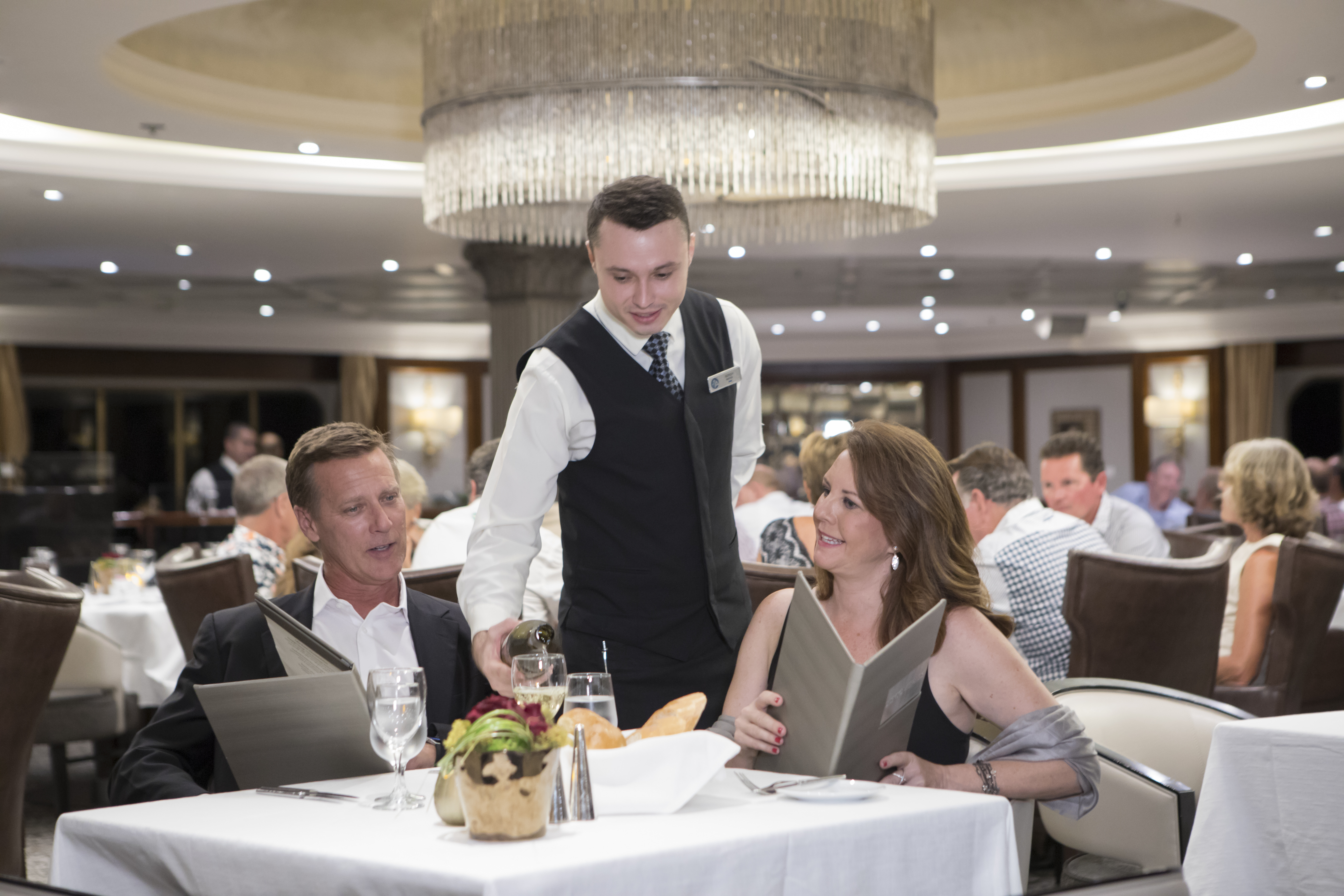 waiter is serving wine