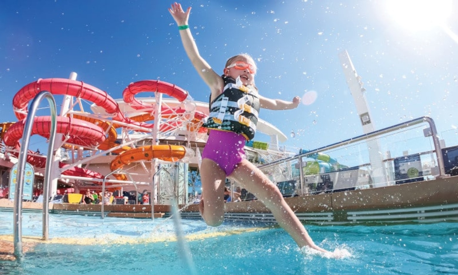child jumping into a pool on board Wonder of the Seas