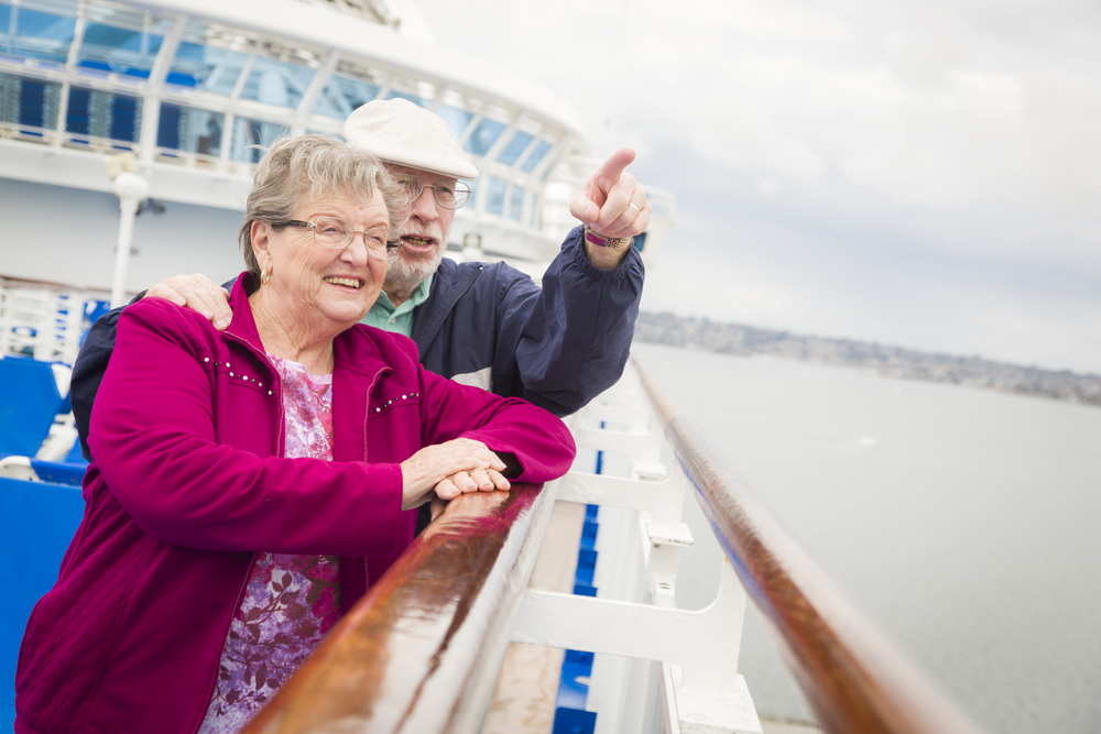 Happy senior couple enjoying the view from deck