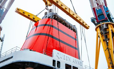 Queen Anne dons her iconic red and black funnel as construction progresses