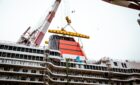 Queen Anne dons her iconic red and black funnel as construction progresses