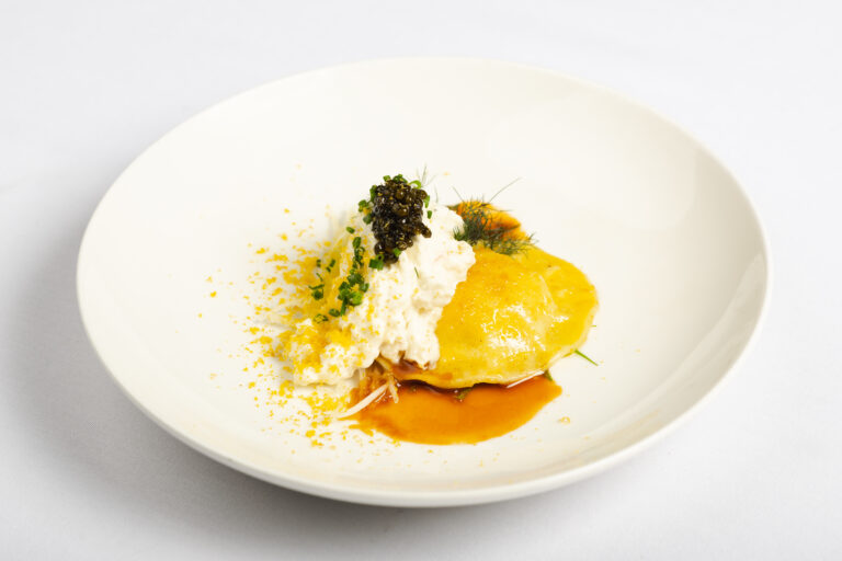 Ricotta raviolo with spanner crab, crema, caviar, bonito jelly, bottarga with white radish, bronze fennel and sorrel
