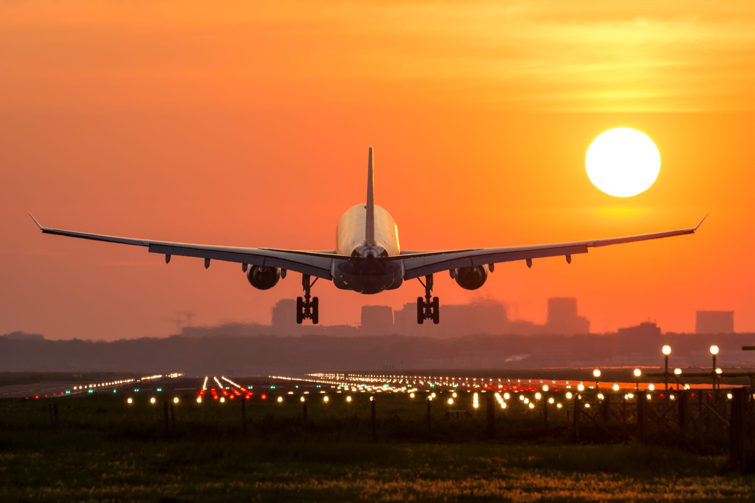 Passenger Plane Is Landing During A Wonderful Sunrise