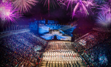 Fireworks, parade, bleachers with people