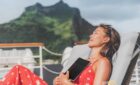 Tourist reading a book in a cruise ship