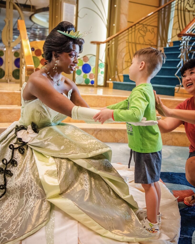 A kid on a Disney Cruise meets a character.