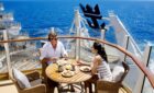 A couple enjoys a meal via Royal Caribbean ship.