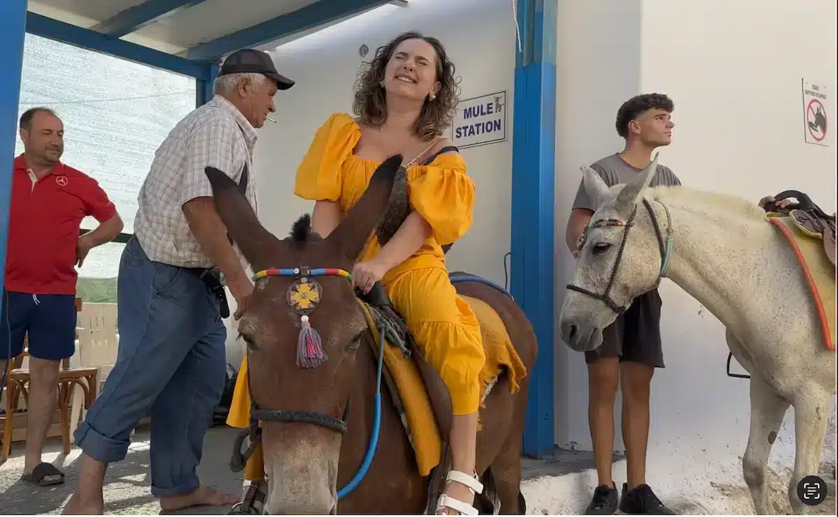 woman riding a horse smiling