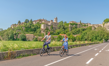A couple bike riding in the French countryside