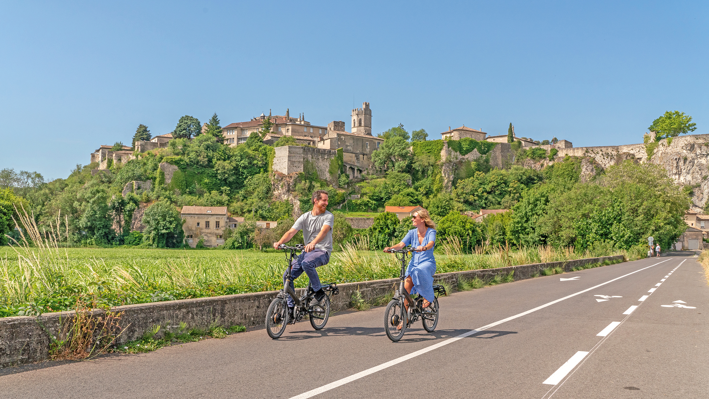 A couple bike riding in the French countryside