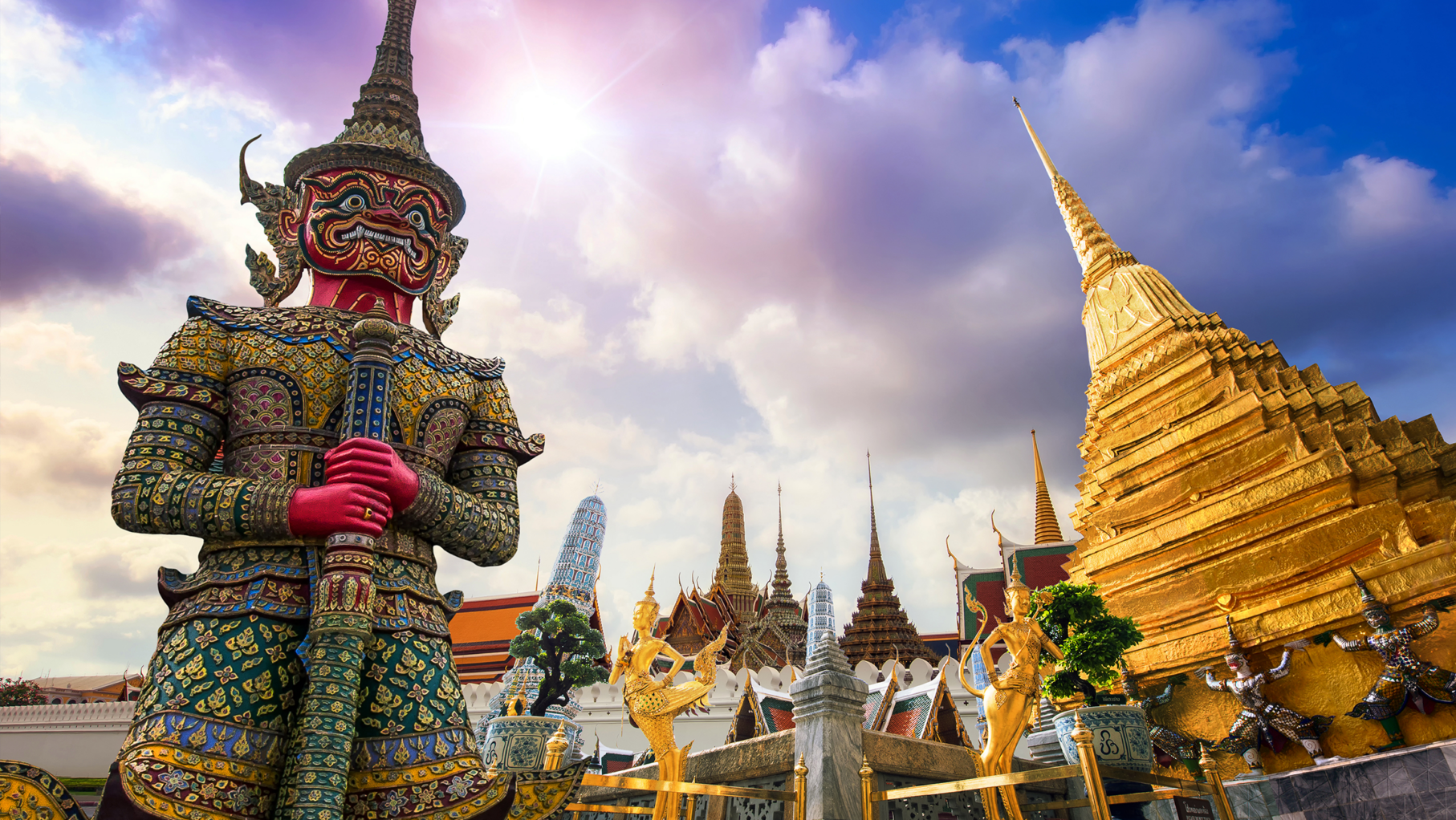 A statue and pagoda in Bangkok