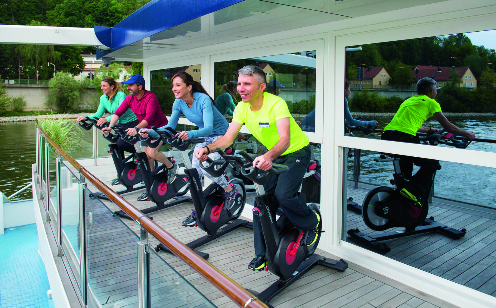 People on stationary bikes for a spin class.