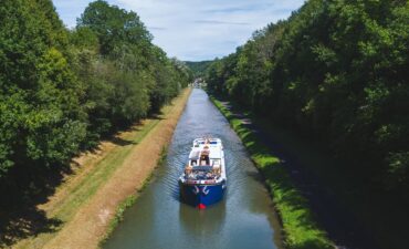 A canal boat on a cruise.