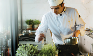 A chef cooking onboard an APT ship