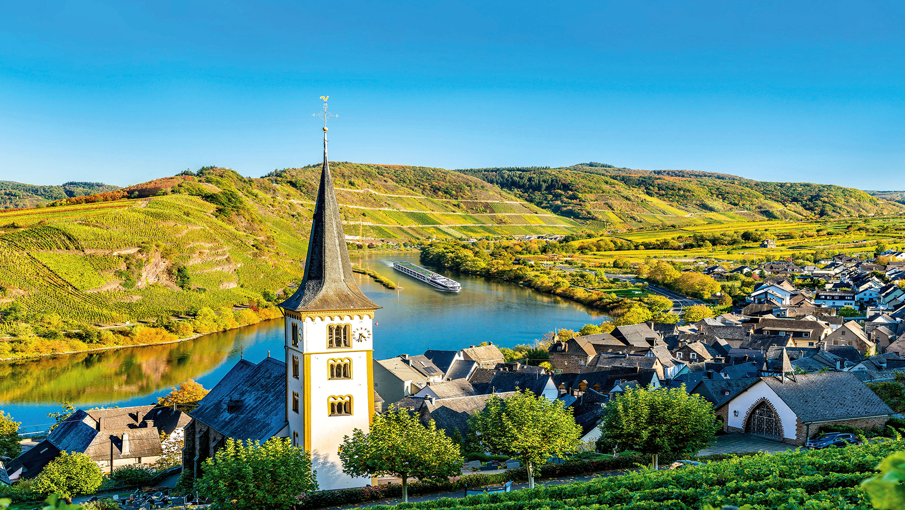 A castle on the Moselle River with a ship in the background