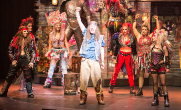 The We Will Rock You Show on Anthem of the Seas performers singing