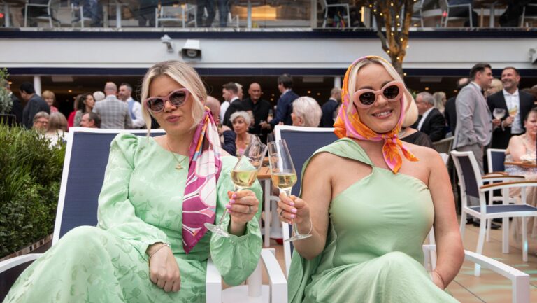 Two influencers with champagne new Queen Anne