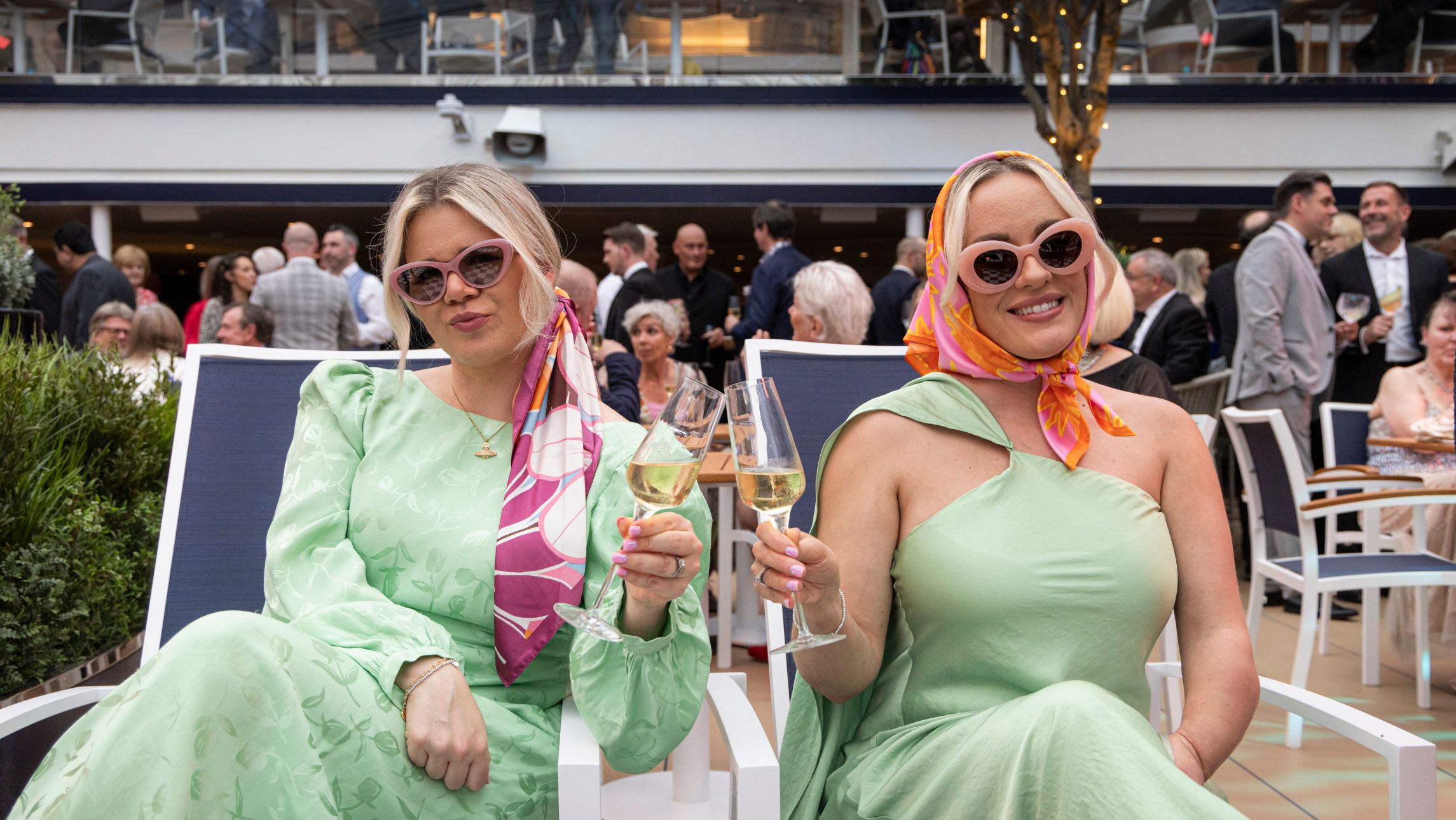 Two influencers with champagne new Queen Anne