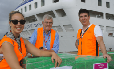 CP DAVID JONES WITH COLLEAGUES ELISA BONACCORDO AND BRAD COYNE WITH VANUATU CYCLONE AID ON PACIFIC DAWN