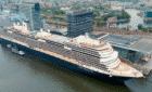 A cruise ship in port at Amsterdam cruise cuts.
