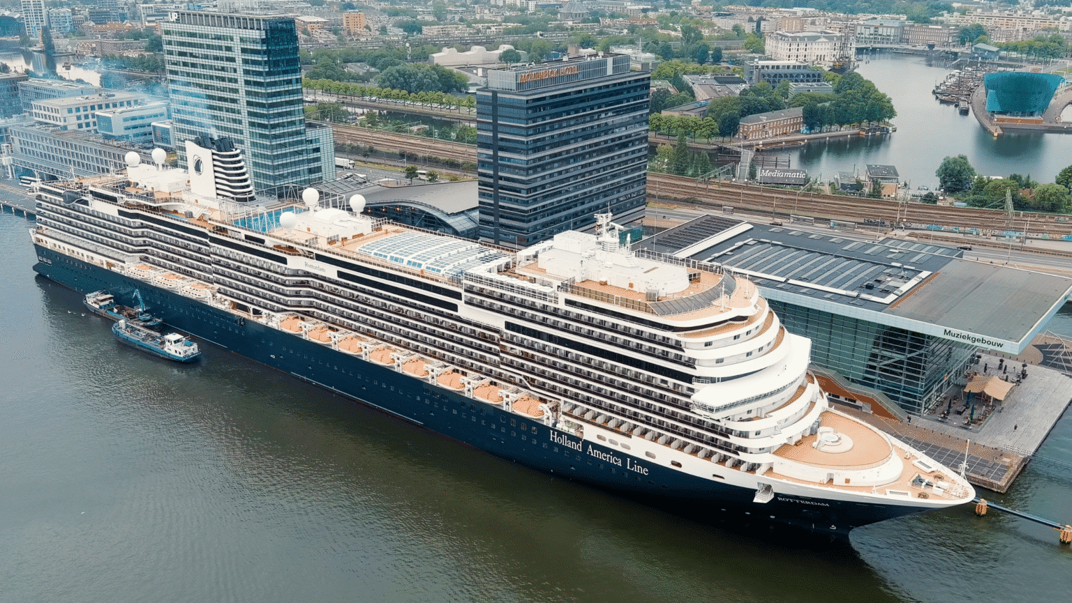 A cruise ship in port at Amsterdam cruise cuts.