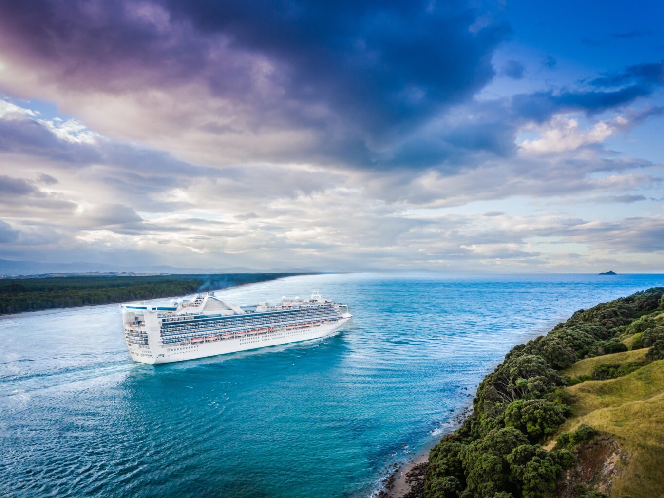 A cruise ship leaving the country New Zealand cruises