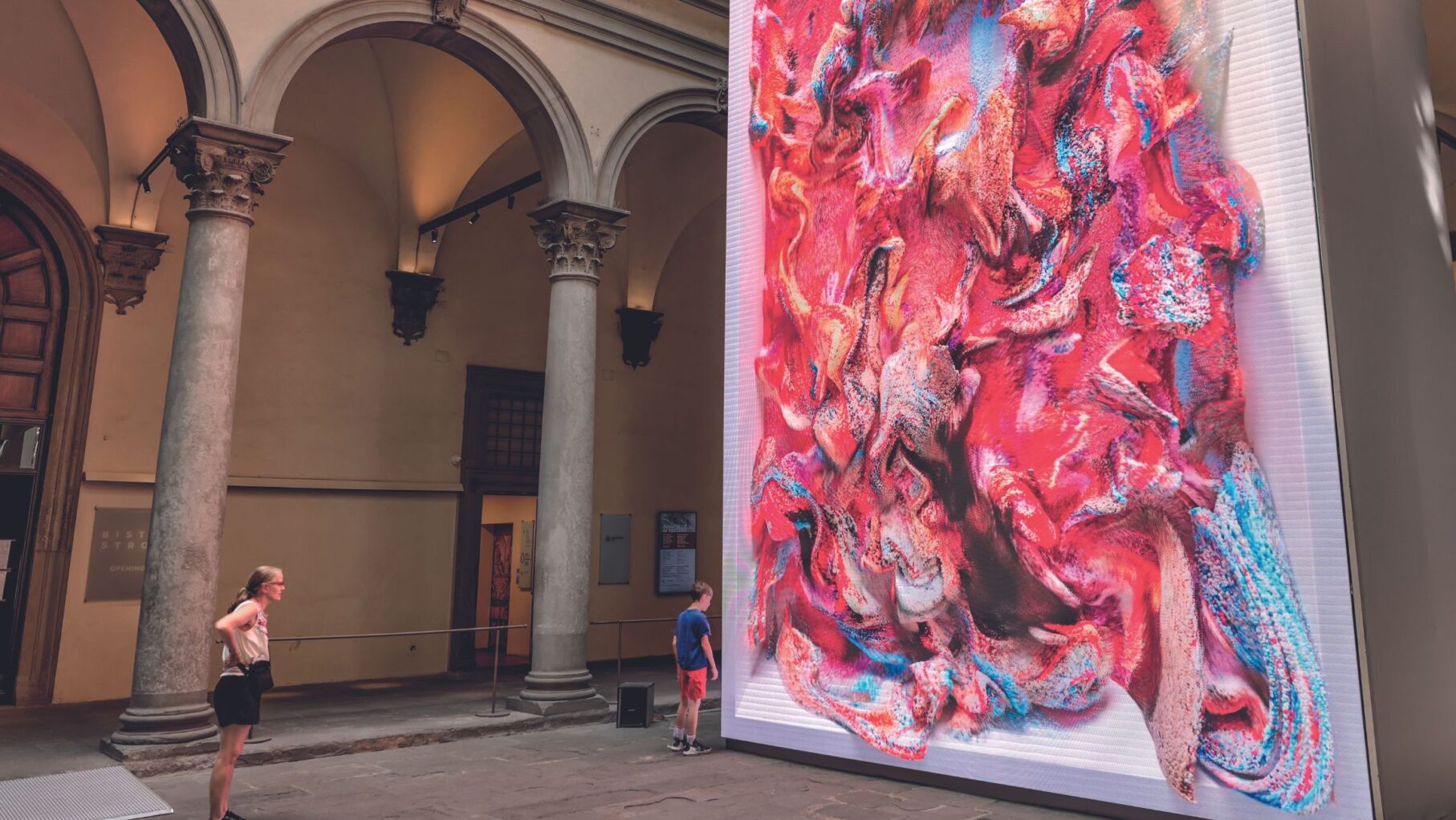 A woman admiring a virtual reality artwork.