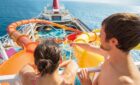 A couple on the Carnival Splendor with waterslide