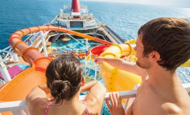 A couple on the Carnival Splendor with waterslide